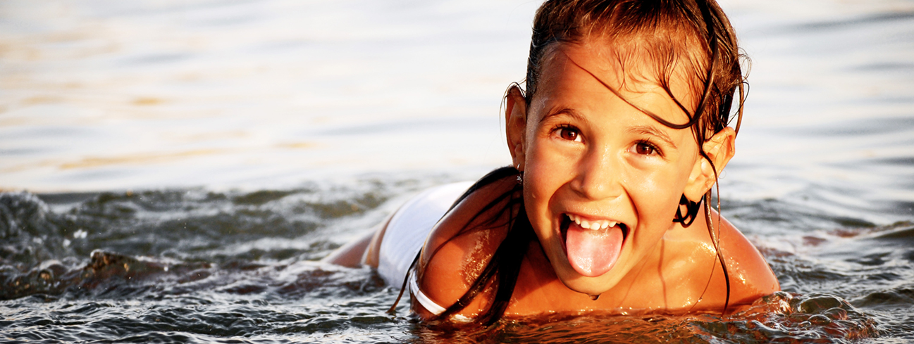 Girl swimming on the beach